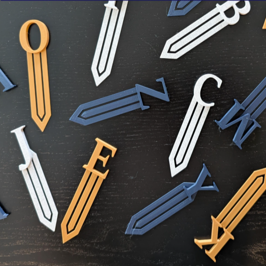 Colorful sword-shaped objects on a dark surface