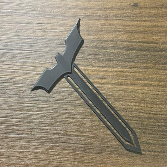Black tactical knife on a wooden surface
