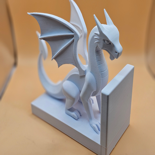White dragon figurine on a stand with a blurred background