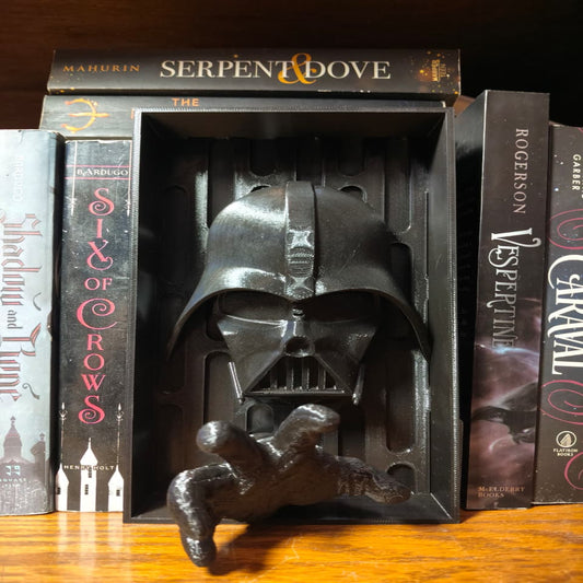 Darth Vader figurine in a book-shaped box with books around it